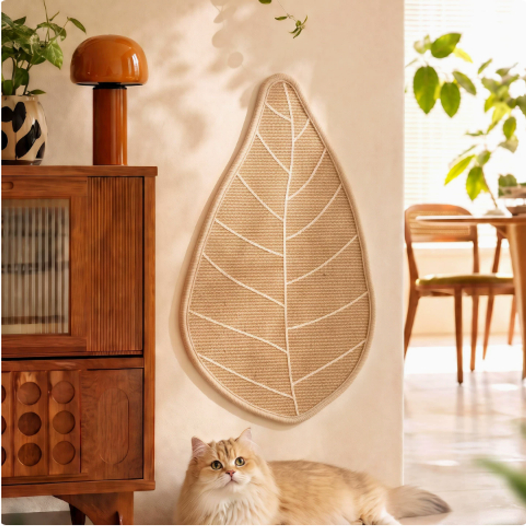 Close view of the Mewnook leaf wall scratcher showing woven sisal and rope vein detail